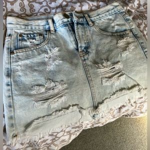 Distressed light wash jean skirt